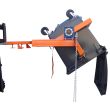 Forklift with industrial wheelie bin tipper attachment tilting large black bin, designed for safe waste handling and emptying.