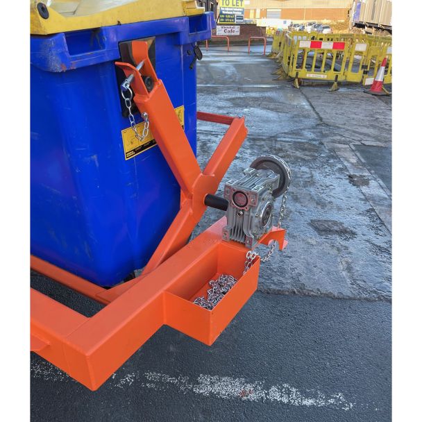 Close-up of industrial wheelie bin tipper forklift attachment mechanism with chain and gearbox for safe bin rotation.