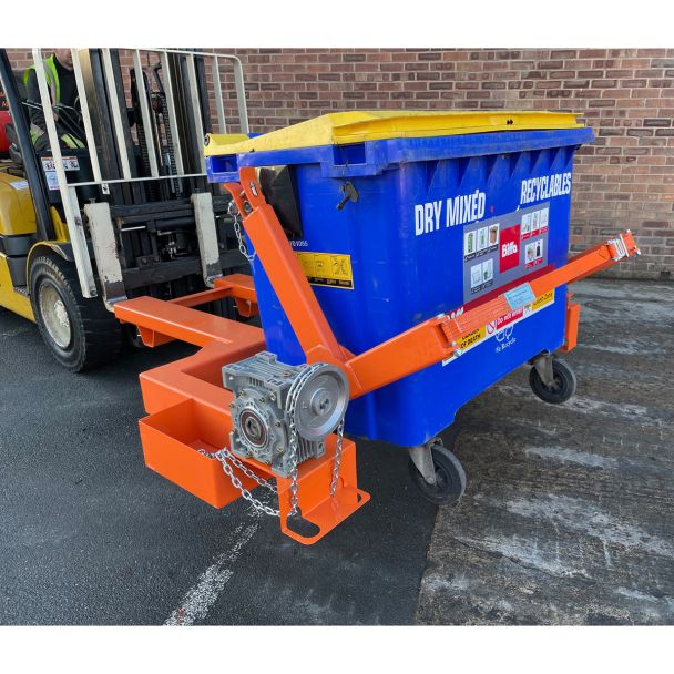 Forklift attachment tipping blue commercial recycling wheelie bin, designed for safe and efficient waste disposal.