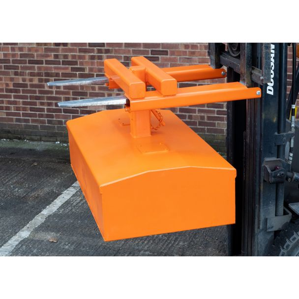 Forklift-mounted skip compactor attachment shown outdoors, providing robust waste handling and compaction for industrial applications.