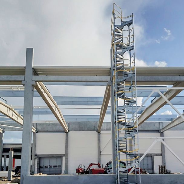 Compact, space-saving spiral staircase system for temporary site access