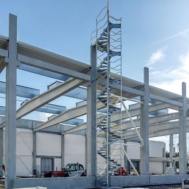 Compact, space-saving spiral staircase system for temporary site access