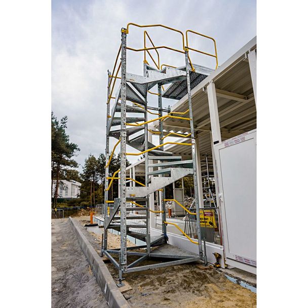 Construction workers using a Temporary Spiral Staircase for multi-level access